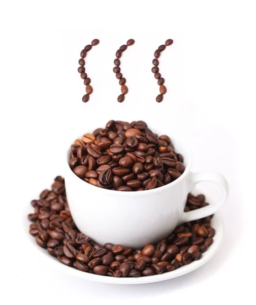 Šálek kávy a pára z fazolí — Stock fotografie