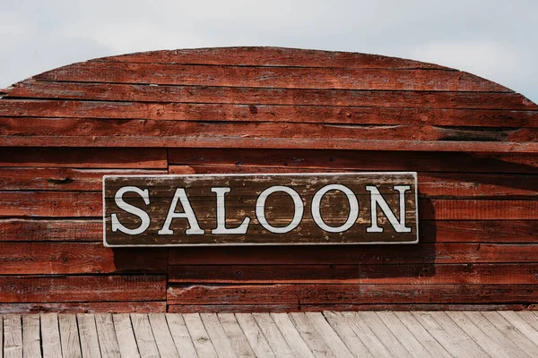 Saloon facade text in wild western city
