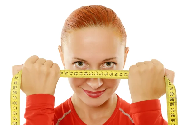 Mujer roja joven con tabe de medición —  Fotos de Stock