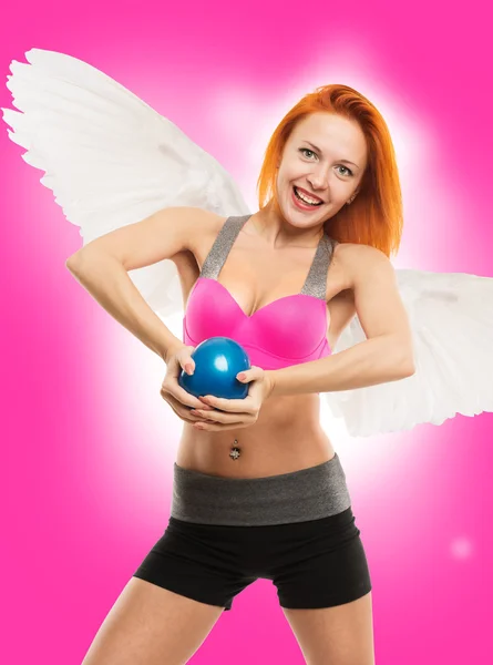 Beautiful sensual angel doing fitness — Stock Photo, Image