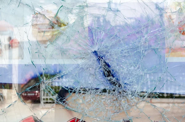 Cracked and broken glass window — Stock Photo, Image