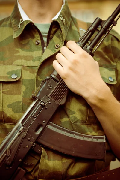 Soldier with AK-47 assault rifle — Stock Photo, Image