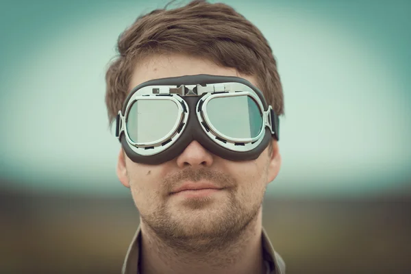 Young man wearing aviator goggles — Stock Photo, Image