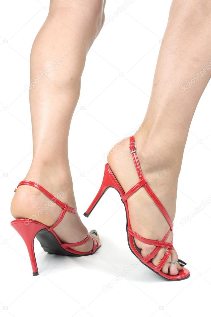 Woman feet wearing high heel shoes