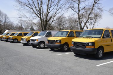 row of school vans clipart