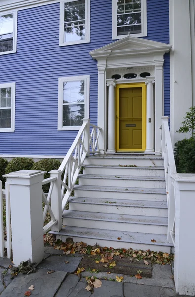 Blue house with yellow door — Stock Photo, Image