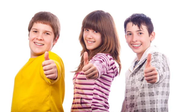 Dos chicos adolescentes y una chica adolescente mostrando pulgares hacia arriba —  Fotos de Stock