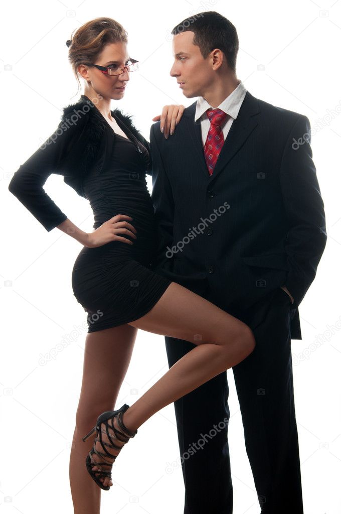 Beautiful sexy lady seducing young businessman isolated on white