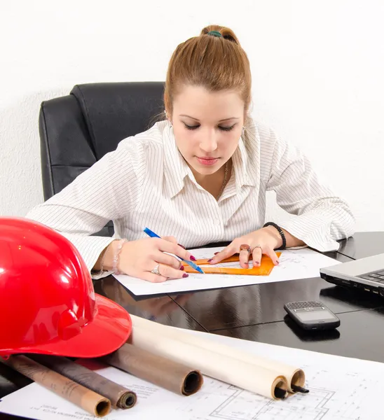 Young female architect working on the project in her office — Stock Photo, Image
