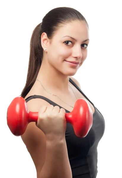 Beautiful girl exercising with dumbbell isolated on white — Stock Photo, Image