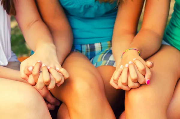 Teenage girls holding hands Stock Image