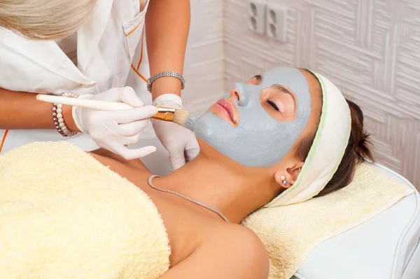 Young woman with natural facial mask — Stock Photo, Image