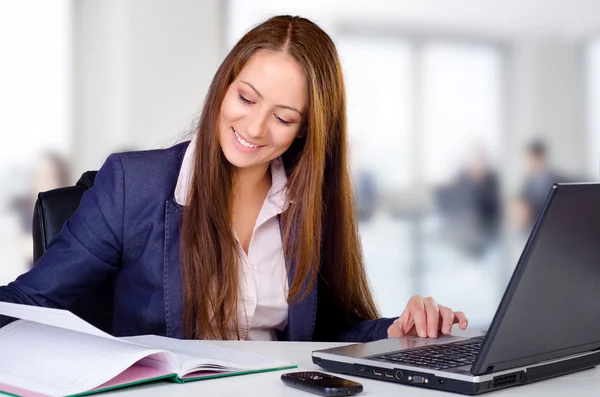 Smiling business woman in her office — Stock Photo, Image