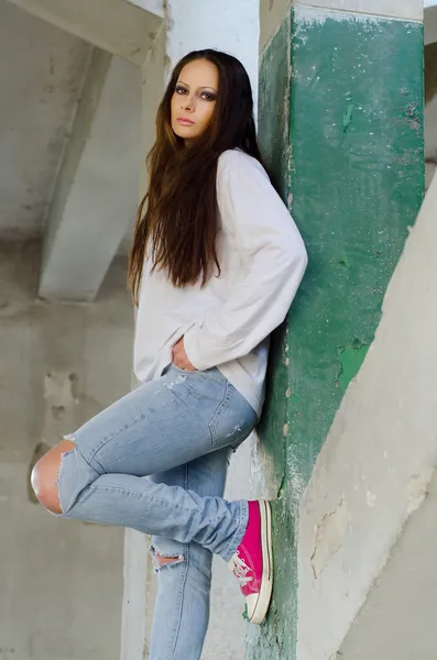 Depressed young girl in the abandoned building — Stock Photo, Image