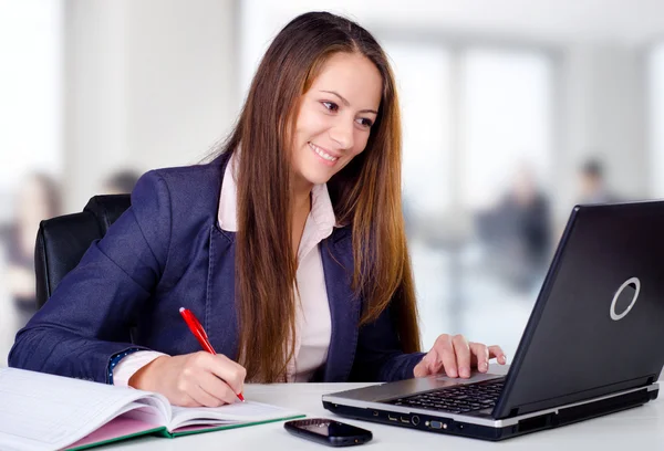 Smiling business woman in her office — Stock Photo, Image