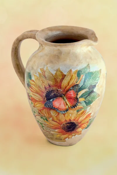 Butterfly on a decoupage jug — Stock Photo, Image