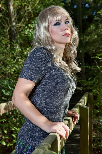 Woman on the wooden bridge — Stock Photo, Image