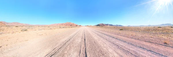 Road through the desert — Stock Photo, Image