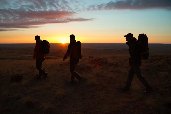 Walking in the sunglow hikers — Stock Photo, Image