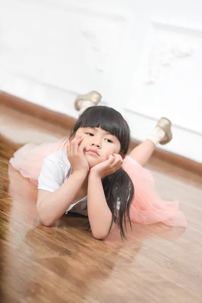 Happy little girl lying — Stock Photo, Image