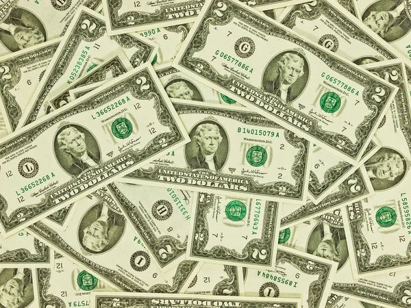 Een stapel van twee dollarbiljetten als geld achtergrond — Stockfoto