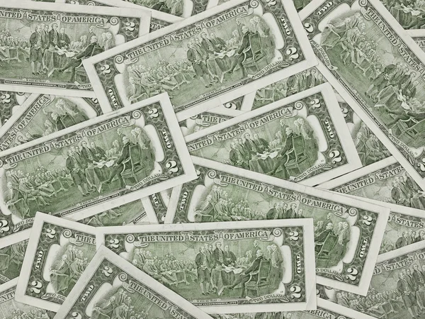 Une pile de projets de loi de deux dollars comme fond monétaire — Photo