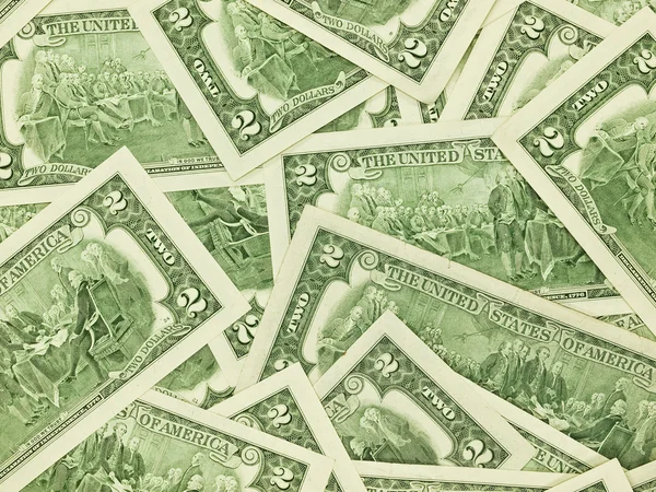Ένα σωρό λογαριασμούς δολαρίων δύο ως φόντο χρήματα — Φωτογραφία Αρχείου