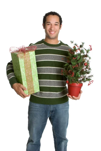 Hombre sosteniendo regalo y árbol decorativo de Navidad — Foto de Stock