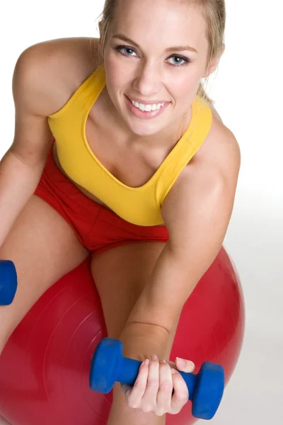 Sportswoman training with dumbbells and rubber ball Royalty Free Stock Photos