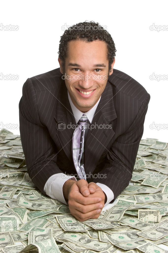 Business man lying on money