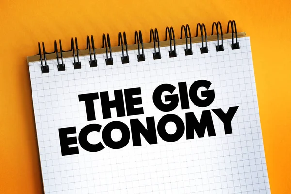 The Gig Economy text on notepad, concept backgroun