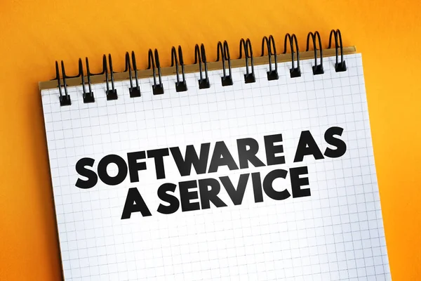 Software as a service text quote on notepad, concept background