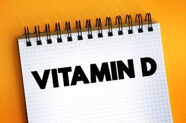 D vitamini - kalsiyum, magnezyum ve fosfat ve diğer biyolojik etkilerin yüksek bağırsak emiliminden sorumlu yağ çözünür secosteroidler grubu, not defteri üzerindeki metinler