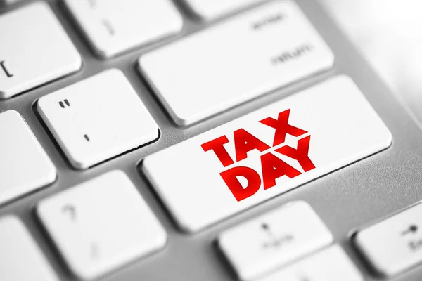 Tax Day text button on keyboard, concept background