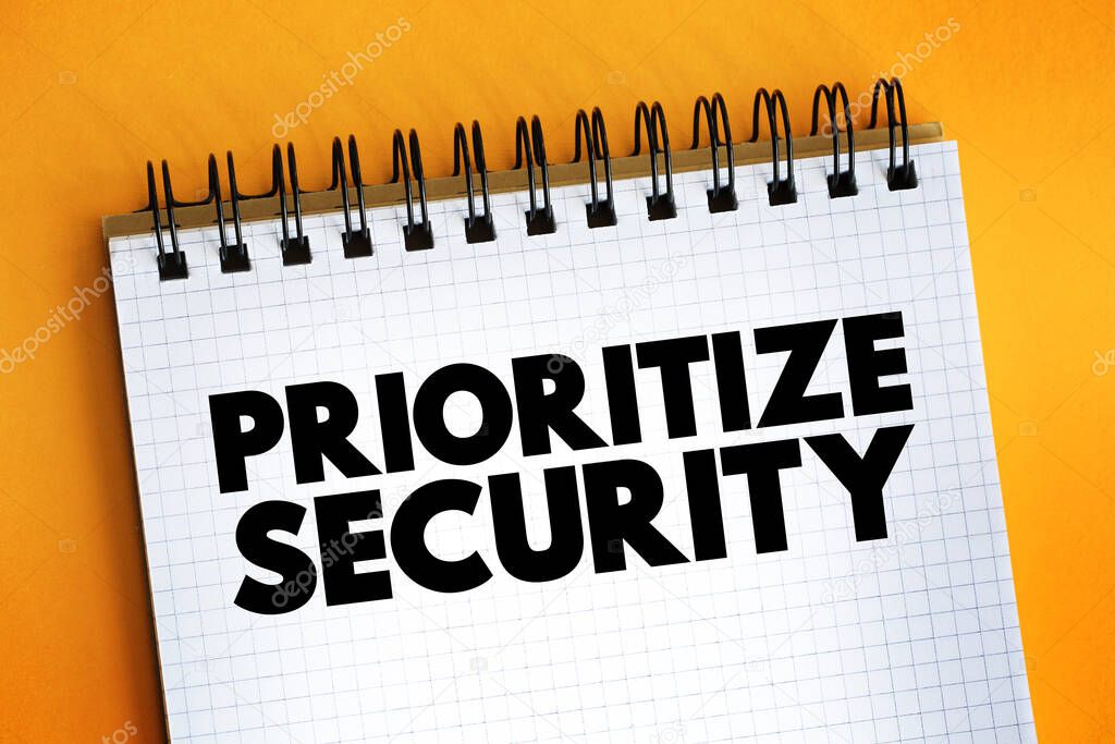 Prioritize Security text on notepad, concept background