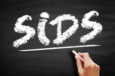 Ani Bebek Ölümü Sendromu. Bir yaşından küçük bir çocuğun açıklanamayan ölümü. Tahtadaki kısaltma.