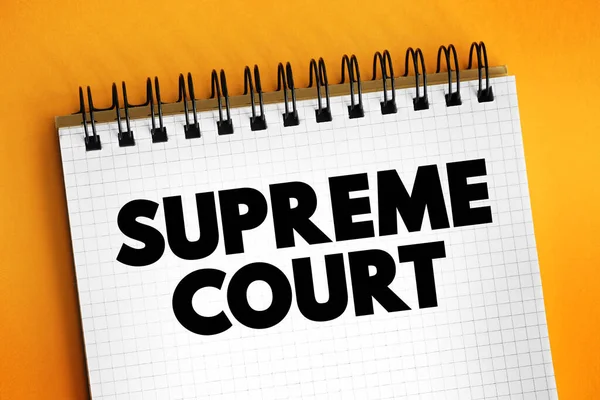 Supreme Court - highest court in the federal judiciary, text concept on notepad