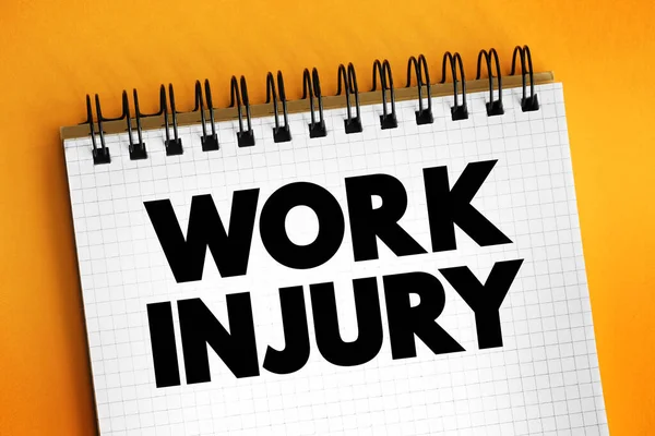 Work Injury - personal injury, disease or death resulting from an occupational accident, text concept on notepad