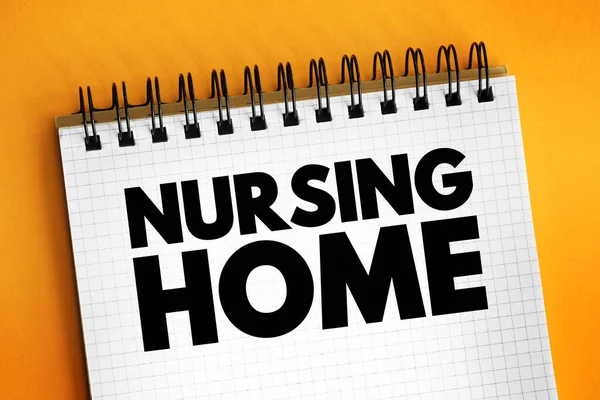 Nursing home - facility for the residential care of elderly or disabled people, text concept on notepad