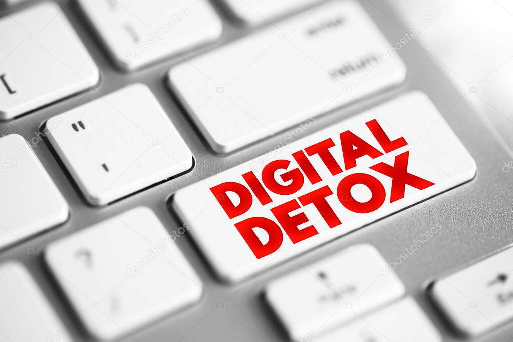 Digital Detox - period of time when a person voluntarily refrains from using digital devices, text concept button on keyboard