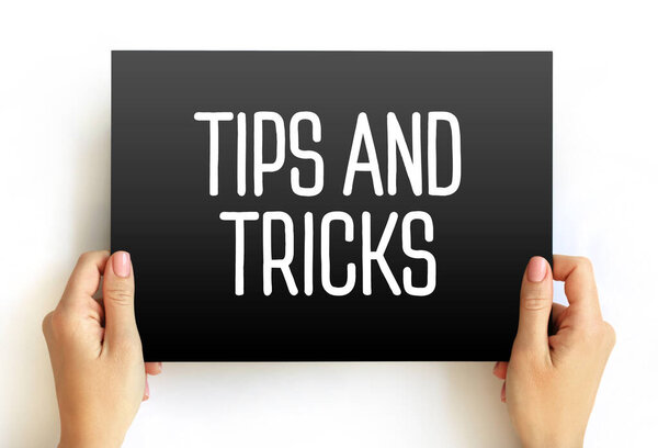 Tips And Tricks text on card, concept background
