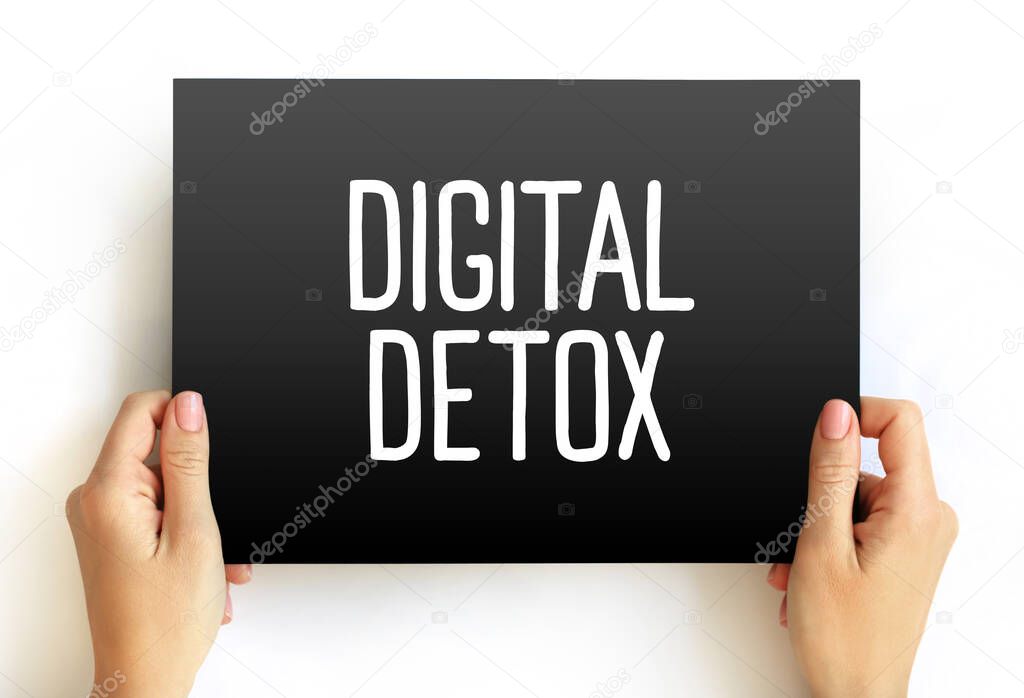 Digital Detox - period of time when a person voluntarily refrains from using digital devices, text concept on card