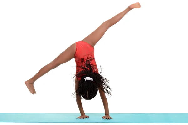 Young black girl doing gymnastics cartwheel motion blur — Stock Photo, Image