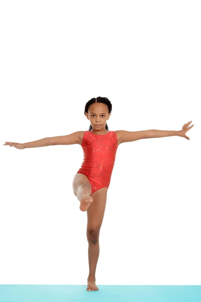 You child doing gymnastics on blue mat — Stock Photo, Image