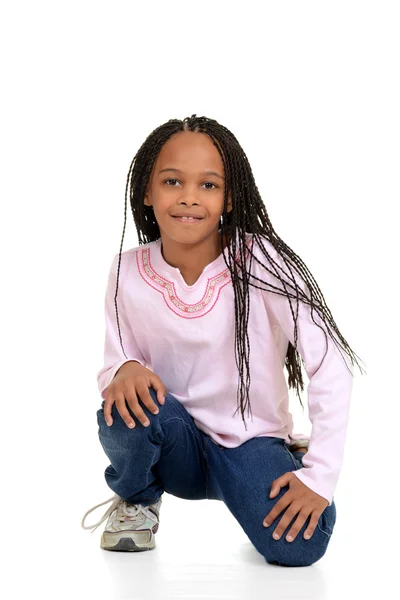 Black girl with corn rows sitting — Stock Photo, Image
