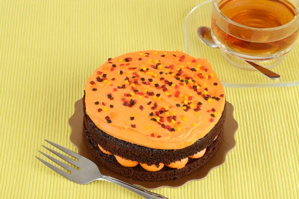 Orange chocolate cake with tea — Stock Photo, Image