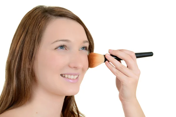 Teenager putting on blush — Stock Photo, Image