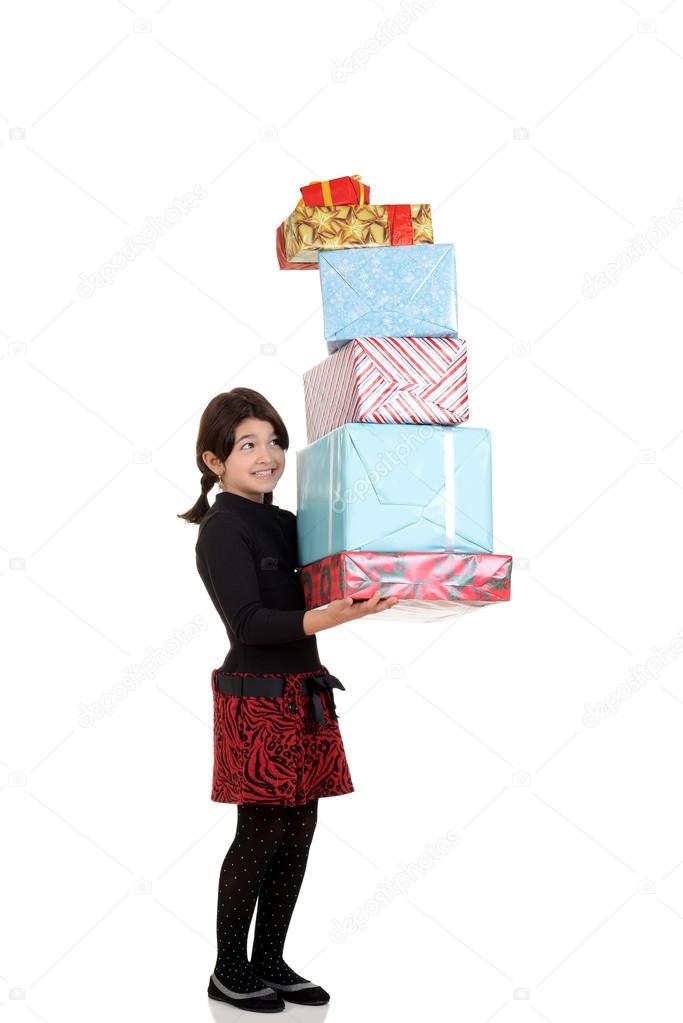 Little girl carrying huge pile of christmas presents
