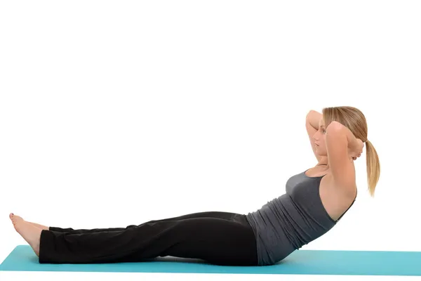 Mujer haciendo pilates tirón del cuello — Foto de Stock