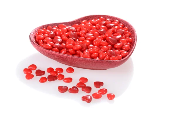 Valentines candy in a red heart bowl — Stock Photo, Image